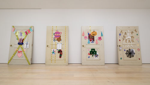 Four hugely oversized doors decorated in the style of the seasons
