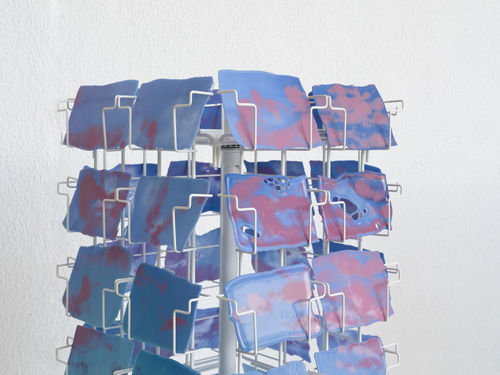 Postcard rack stocked with postcard-sized images of the sky