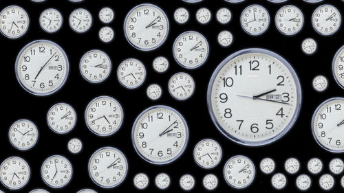 Dozens of clocks, set to different times