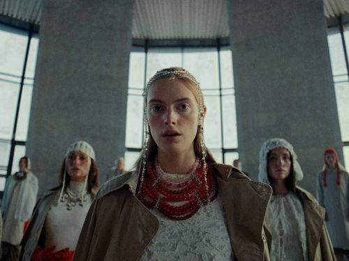 Woman with beaded headcover and necklace