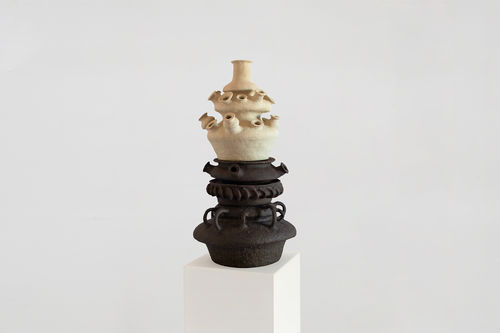 Large, stacked ceramic in black and white with multiple mouth/earpieces