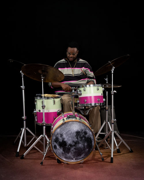 Machado Mijiga plays the drums