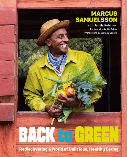 A smiling man in a yellow jacket and hat stands in a wooden doorway, holding fresh vegetables and herbs. Text on the image promotes a book titled “Back to Green.”