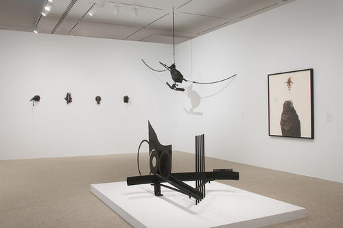 Foreground: Melvin Edwards, "The Fourth Circle," 1966; left wall and hanging: five more works by Melvin Edwards; right wall: Charles White, "Harriet," 1972. Installation view at the Hammer Museum, Los Angeles