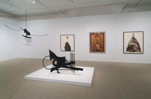Foreground: Melvin Edwards, "The Fourth Circle," 1966; hanging: Melvin Edwards, "Double Chain," 1966; wall: three works by Charles White, from left to right: "Harriet,", 1972, "Black Pope (Sandwich Board Man)," 1973, and "Mississippi," 1972. Installation view at the Hammer Museum, Los Angeles