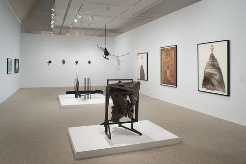 Foreground: Melvin Edwards, "August the Squared Fire," 1965; back wall and hanging: multiple works by Melvin Edwards; right wall: multiple works by Charles White. Installation view at the Hammer Museum, Los Angeles