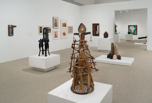 Foreground: Betye Saar, "Spirit Catcher," 1977. Immediately behind, from left to right: Betye Saar, "Indigo Mercy," 1975 and Dale Brockman Davis, "Viet Nam War Games," 1969. Installation view at the Hammer Museum, Los Angeles