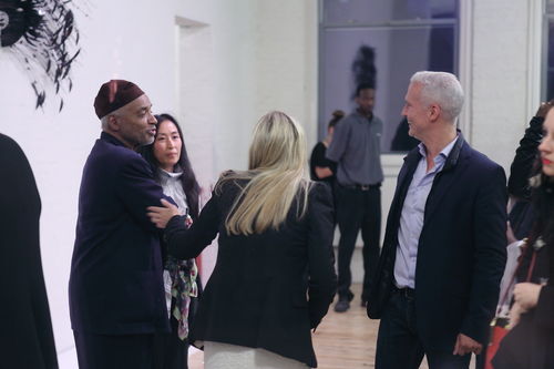 Artist David Hammons (left) and MoMA PS1 director Klaus Biesenbach (right) at the opening reception for "Now Dig This!" MoMA PS1, Long Island City, NY
