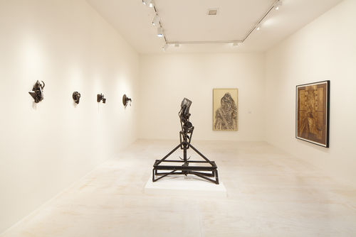 Foreground: Melvin Edwards, "The Lifted X," 1965; left wall: four works by Melvin Edwards; back wall: Charles White, "Birmingham Totem," 1964; right wall: Charles White, "Black Pope (Sandwich Board Man)," 1973. Installation view at MoMA PS1, Long Island City, NY