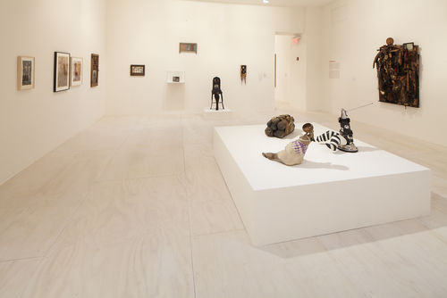 Foreground: three works by John Outterbridge; left and back walls: works by Betye Saar; right wall: Noah Purifoy, "Untitled (Assemblage)," 1967. Installation view at MoMA PS1, Long Island City, NY