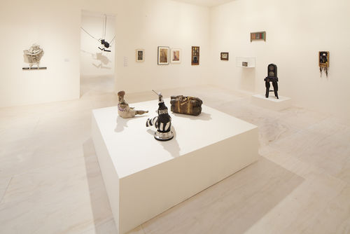 Foreground: three works by John Outterbridge, from left to right: "Untitled," c. 1974–76, "Captive Image #4," from the Ethnic Heritage Group, c. 1974–76, and "Case in Point," from the Rag Man Series, c. 1970; background: works by Betye Saar, John Outterbridge, and Melvin Edwards. Installation view at MoMA PS1, Long Island City, NY