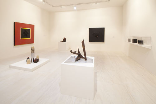 Foreground: Mark di Suvero, "Untitled," c. 1965  and Dale Brockman Davis, "Viet Nam War Games,"1969; background: works by Daniel LaRue Johnson and Dale Brockman Davis. Installation view at MoMA PS1, Long Island City, NY
