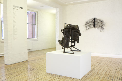 Foreground: Melvin Edwards, "Cotton Hangup," 1966; background: David Hammons,"Flight Fantasy," 1983. Installation view at MoMA PS1, Long Island City, NY