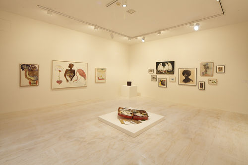 Foreground: Dan Concholar, "Suitcase," c. 1980; left wall: three works by Suzanne Jackson; in corner: Houston Conwill, "Drum," 1975–80; right wall: works by Elizabeth Leigh-Taylor, David Hammons, Suzanne Jackson, William Pajaud, and Tyrus Wong. Installation view at MoMA PS1, Long Island City, NY