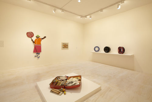 Foreground: Dan Concholar, "Suitcase," c. 1980; left wall: Marie Johnson Calloway, "School Crossing Guard," 1970s and Alonzo Davis, "Untitled," 1978–79; right wall: three works by Fred Eversley. Installation view at MoMA PS1, Long Island City, NY