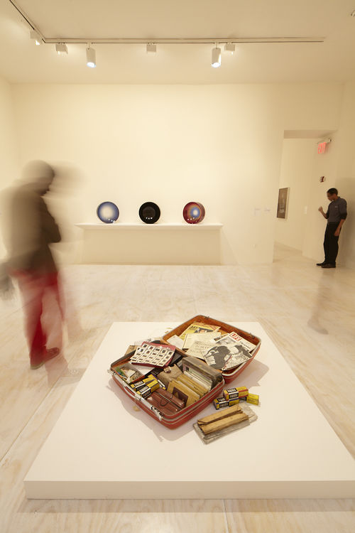 Foreground: Dan Concholar, "Suitcase," c. 1980; background: works by Fred Eversley. Installation view at MoMA PS1, Long Island City, NY