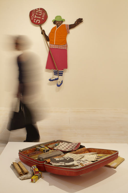Foreground: Dan Concholar, "Suitcase," c. 1980; background: Marie Johnson Calloway, "School Crossing Guard," 1970s. Installation view at MoMA PS1, Long Island City, NY