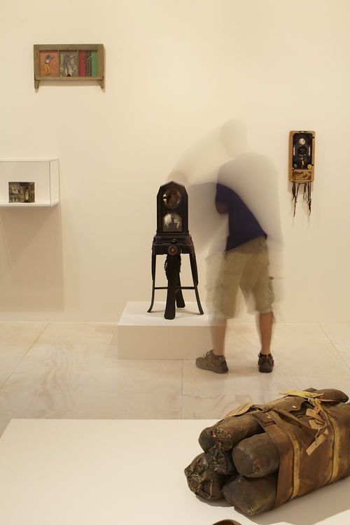 Foreground in corner: John Outterbridge, "Case in Point," from the Rag Man Series, c. 1970; background: four works by Betye Saar. Installation view at MoMA PS1, Long Island City, NY