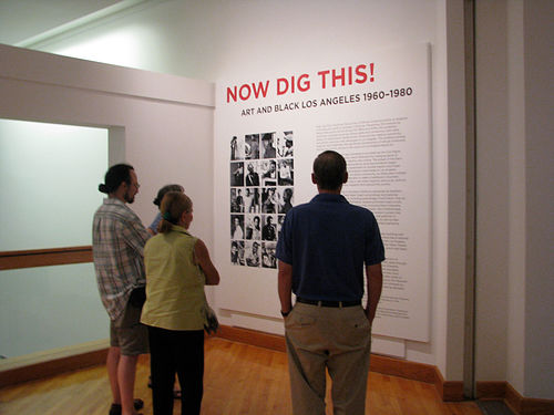 Guests reading entryway sign for "Now Dig This!" Williams College Museum of Art, Williamstown, MA