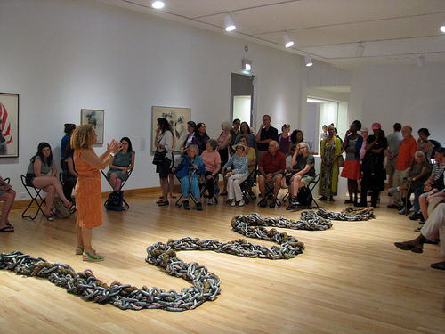 Curator Kellie Jones stands next to Maren Hassinger, "River," 2011, as she leads guests through "Now Dig This!" on opening day. Williams College Museum of Art, Williamstown, MA