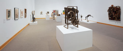 Foreground: Melvin Edwards, "August the Squared Fire," 1965; background: works by Betye Saar, Noah Purifoy, and John T. Riddle Jr. Installation view at Williams College Museum of Art, Williamstown, MA