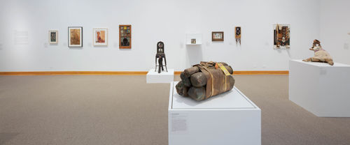 Foreground: John Outterbridge, "Case in Point," from the Rag Man Series, c. 1970 and "Untitled," c. 1974–76; background: works by Betye Saar and Noah Purifoy. Installation view at Williams College Museum of Art, Williamstown, MA