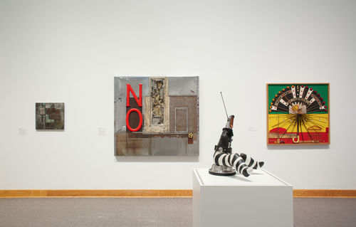 Foreground: John Outterbridge, "Captive Image #4," from the Ethnic Heritage Group, c. 1974–76; background, from left to right: Outterbridge, "Eastside-Westside," from the Containment Series, c. 1970 and "No Time for Jivin'," from the Containment Series, 1969, and Noah Purifoy, "Unknown," 1967. Installation view at Williams College Museum of Art, Williamstown, MA