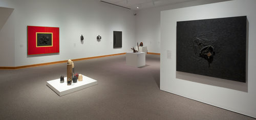 Foreground: Daniel LaRue Johnson, "Freedom Now, Number 1," 1963–64; center: Dale Brockman Davis, "Viet Nam War Games, 1969; background: works by Daniel LaRue Johnson, Ron Miyashiro, Mark di Suvero, and Virginia Jaramillo. Installation view at Williams College Museum of Art, Williamstown, MA