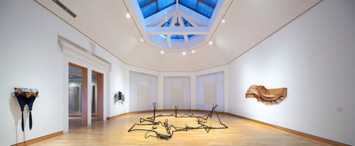 Foreground: Maren Hassinger, "A Place for Nature," 2011; left wall: Senga Nengudi, "Revery - A," 2011 and David Hammons, Flight Fantasy," 1983; right wall: David Hammons, "Bag Lady in Flight," 1970s. Installation view at Williams College Museum of Art, Williamstown, MA