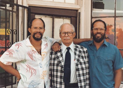 Dale Davis (left) and Alonzo Davis (right) with their father outside Brockman Gallery, Los Angeles, 1970s
