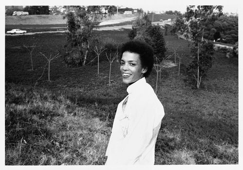 Maren Hassinger in front of "Twelve Trees," Los Angeles, 1978
