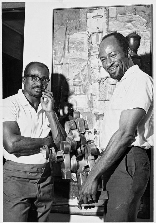 Noah Purifoy (left) and Judson Powell at the "66 Signs of Neon" exhibition, c. 1966