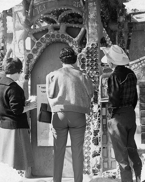 Visitors looking at Simon Rodia's Watts Towers
