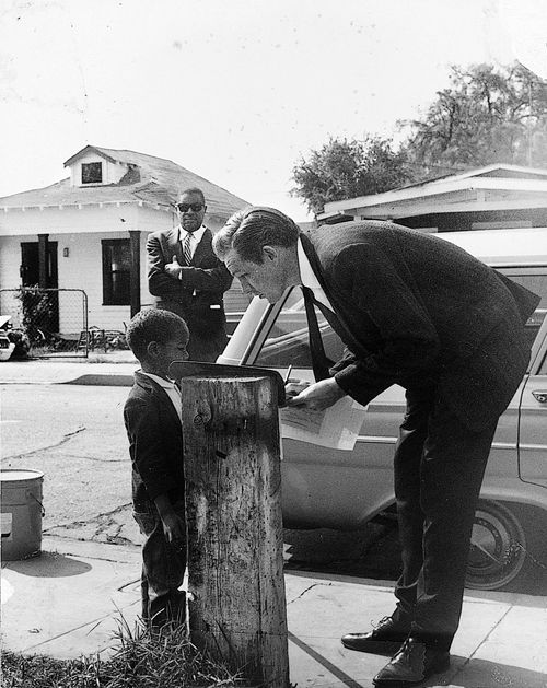 Visitor with young boy at Watts Towers Arts Center
