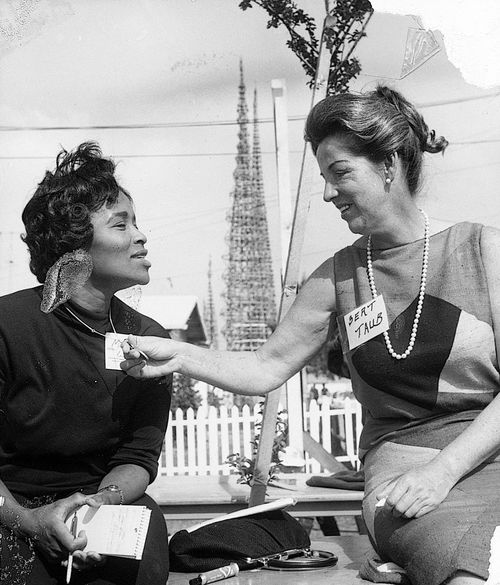 Two women in front of Simon Rodia's Watts Towers.