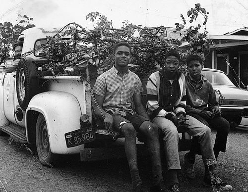 Student Committee for Improvement in Watts (SCFIW) teens hauling debris during "Operation Teacup," an Easter week cleanup, in volunteer Seymour Rosen's truck, April 1965