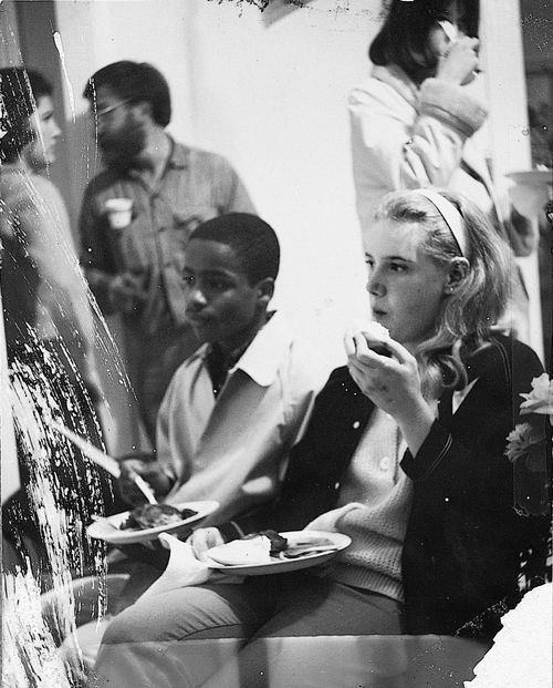 Teens and volunteers enjoying a break during "Operation Teacup,"an Easter week cleanup organized by the Student Committee for Improvement in Watts, April 1965