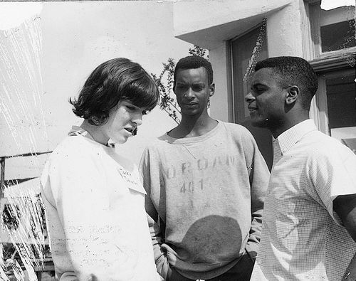 Student Committee for Improvement in Watts (SCFIW) teens Robert Mason and Richard Townsend converse with a volunteer at "Operation Teacup," an Easter week cleanup, April 1965