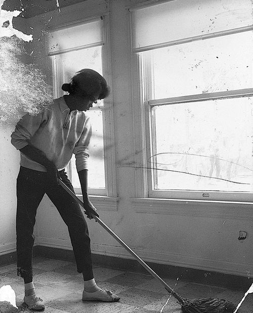 Teen cleaning at Watts Towers Arts Center