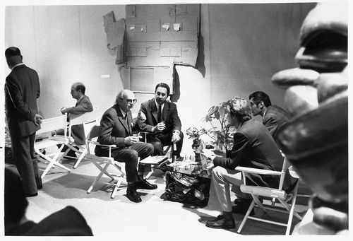 Group talking during "66 Signs of Neon" exhibition at University of California, Los Angeles, c. 1966