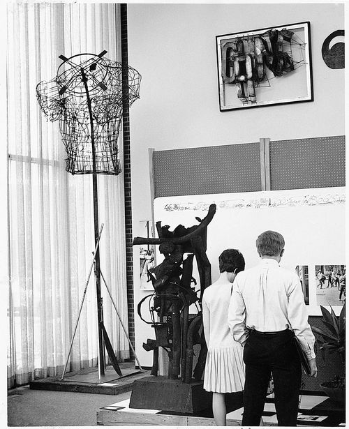 Couple at gallery to view "66 Signs of Neon" at University of California, Los Angeles, c. 1966