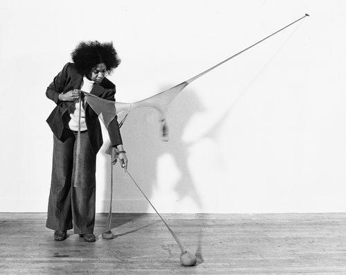 Senga Nengudi setting up for a performance of "RSVP X" in her Los Angeles studio, 1976