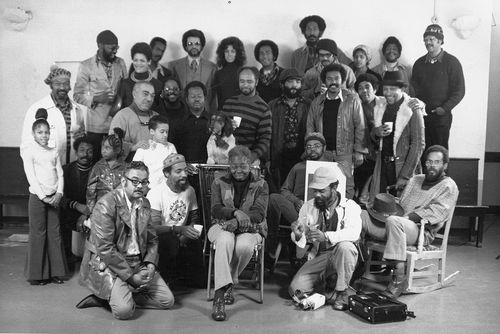 Group photograph taken in Los Angeles, 1970s. Included are John Outterbridge (top row, far left), Dan Concholar (middle row, fourth from right), John T. Riddle Jr. (middle row, second from right), William Pajaud (front row, far left), David Hammons (front row, second from left), Ruth G. Waddy (front row, center), and Alonzo Davis (seated, far right)