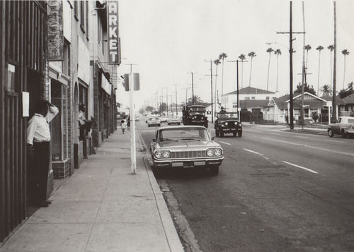 View of street during Watts rebellion, Los Angeles, August 1965