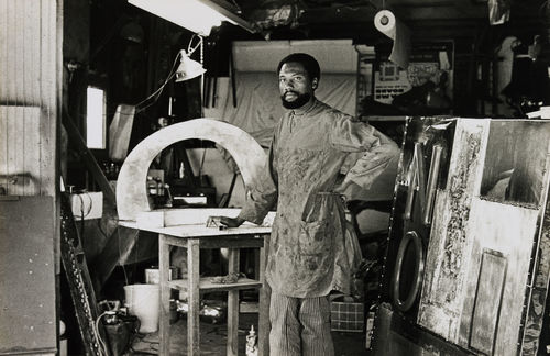 John Outterbridge in his Los Angeles studio with "No Time for Jivin',"1969, at right, 1970