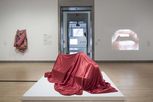 The Erotic gallery. Center, on floor: Feliza Bursztyn, Cama (Bed), 1974. On wall, from left to right: Marta Minujín, Colchón (Mattress), 1964/1985, and Lygia Pape, Eat Me, 1975. Installation view at Brooklyn Museum, New York
