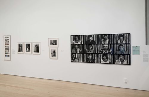 Social Places gallery. From left to right: Anna Bella Geiger, Brasil nativo, Brasil Alienígena (Native Brazil/Alien Brazil), 1977, three photographs by Graciela Iturbide, two photographs by Lourdes Grobet,  from the series La doble lucha (The double struggle), and Claudia Andujar, works from the series Marcados (Marked), 1981–83. Installation view at Brooklyn Museum, New York
