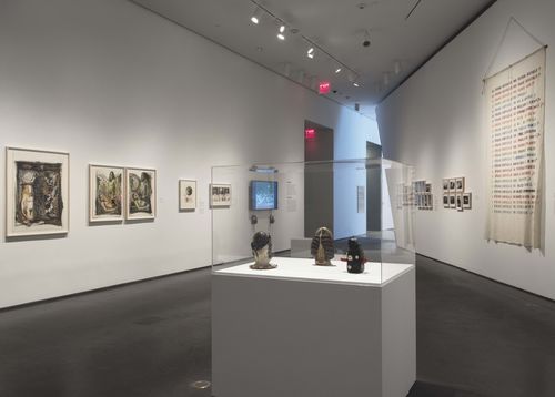 Feminisms gallery. In vitrine, from left to right: Tecla Tofano, Sra. Mascara de Cutis (Mrs. Skin Mask), 1977, En via de liberación (On the way to liberation), 1975, and Medio de reproducción visual (Visual reproduction medium), 1973. Installation view at Brooklyn Museum, New York
