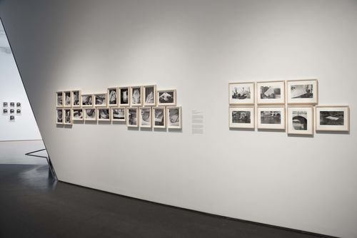 Feminisms gallery. From left to right: Ana Victoria Jiménez, photographs from the series Cuaderno de tareas (Assignment Book), 1978–81, and Lea Lublin, Dissolution dans l'eau, Pont Marie, 17 heures (Dissolution in the Water, Pont Marie, 5pm), 1976. Installation view at Brooklyn Museum, New York
