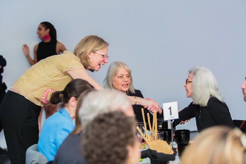 Curator Catherine Morris (left)  shakes hands with artist Sylvia Palacios Whitman, as catalog contributor Carla Stellweg (center) looks on, at the luncheon reception honoring Radical Women. Brooklyn Museum, April 12, 2018
